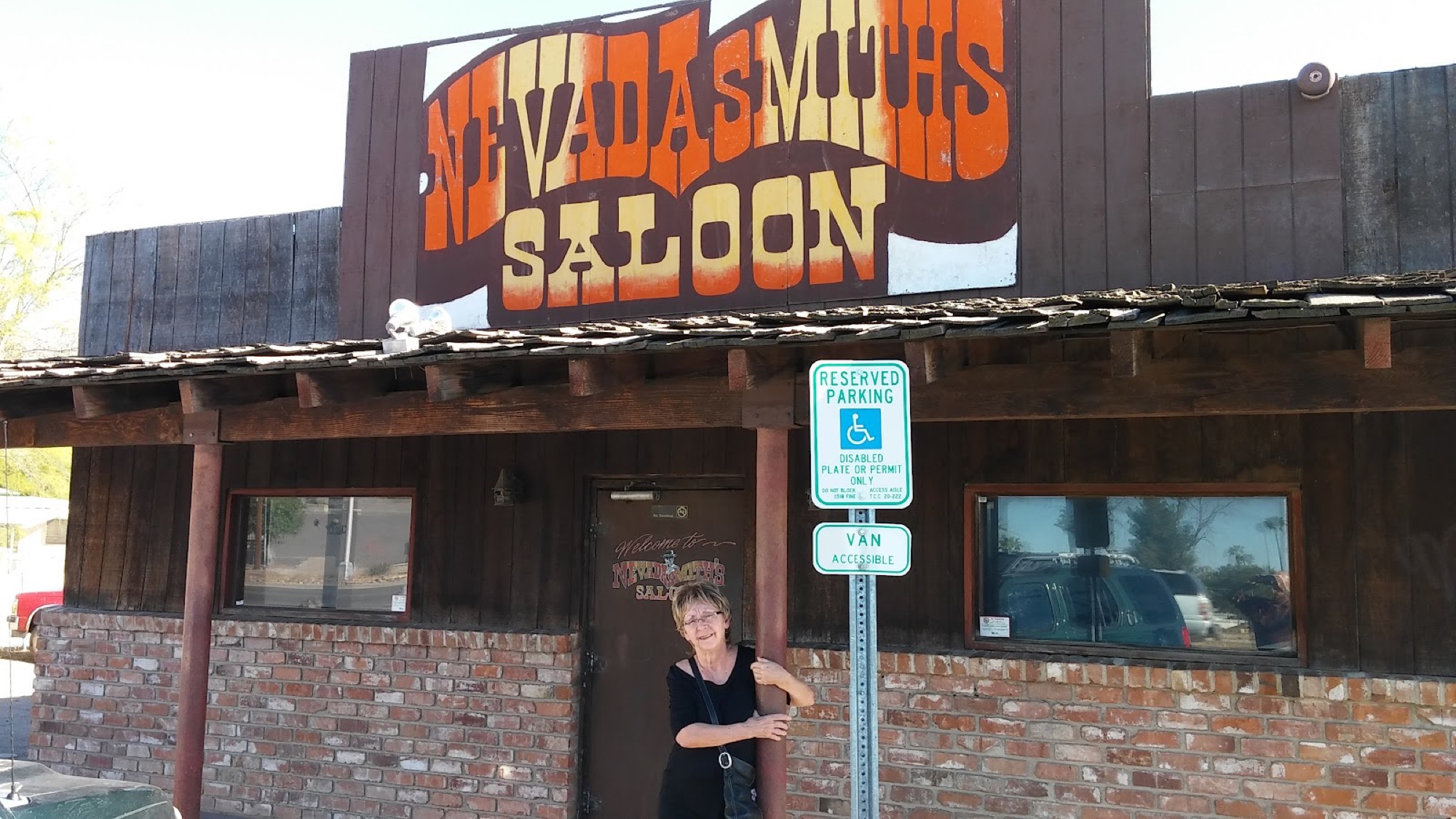 The hand-painted Nevada Smith’s Saloon sign over the wood storefront.